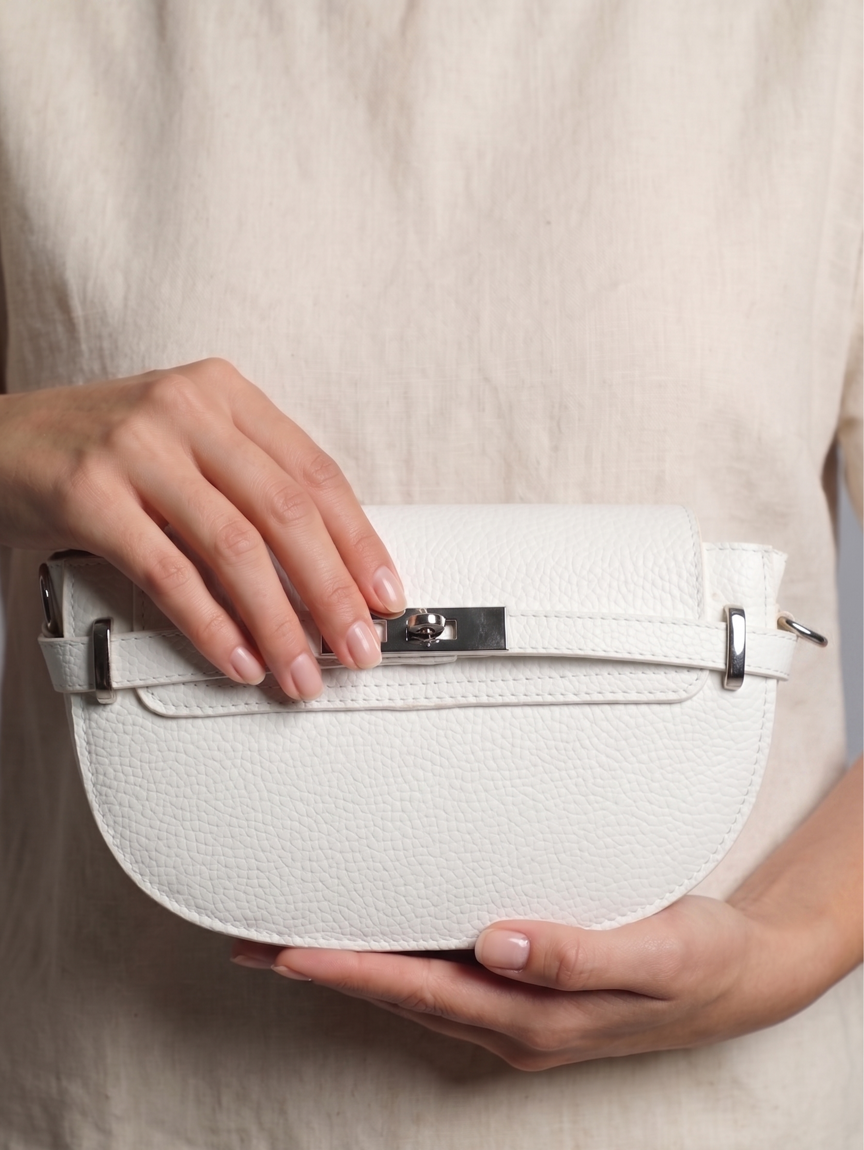 White Textured Clutch Bag With A Sleek Buckle Details