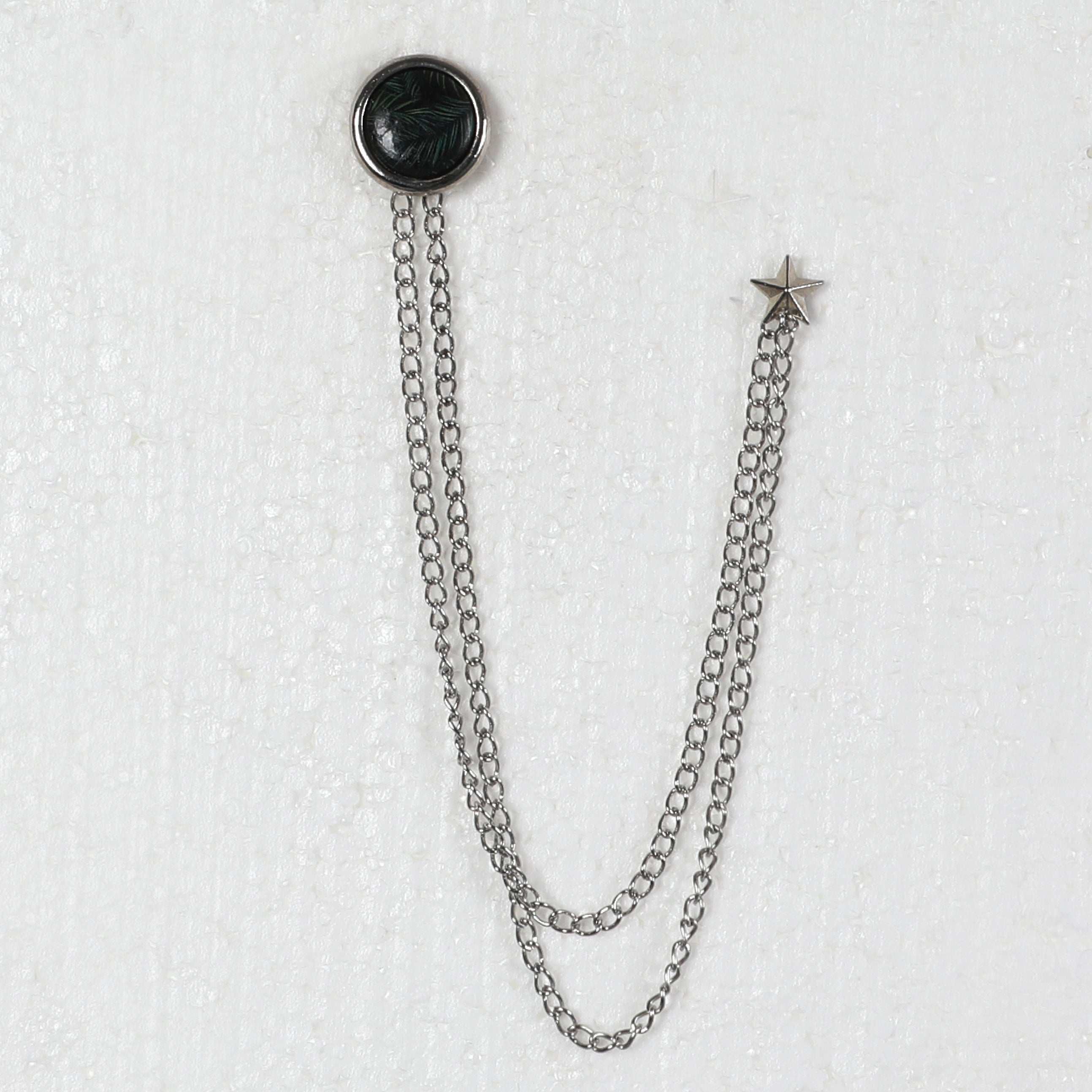 Silver Chained Pin With Circled Ornamented Black Design