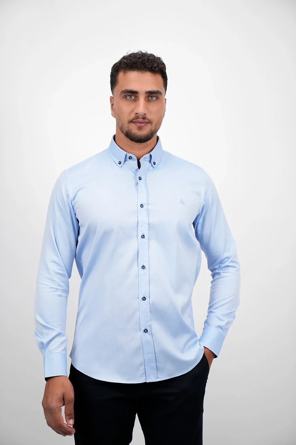 Blue Long Sleeved Shirt With Black Button To Close