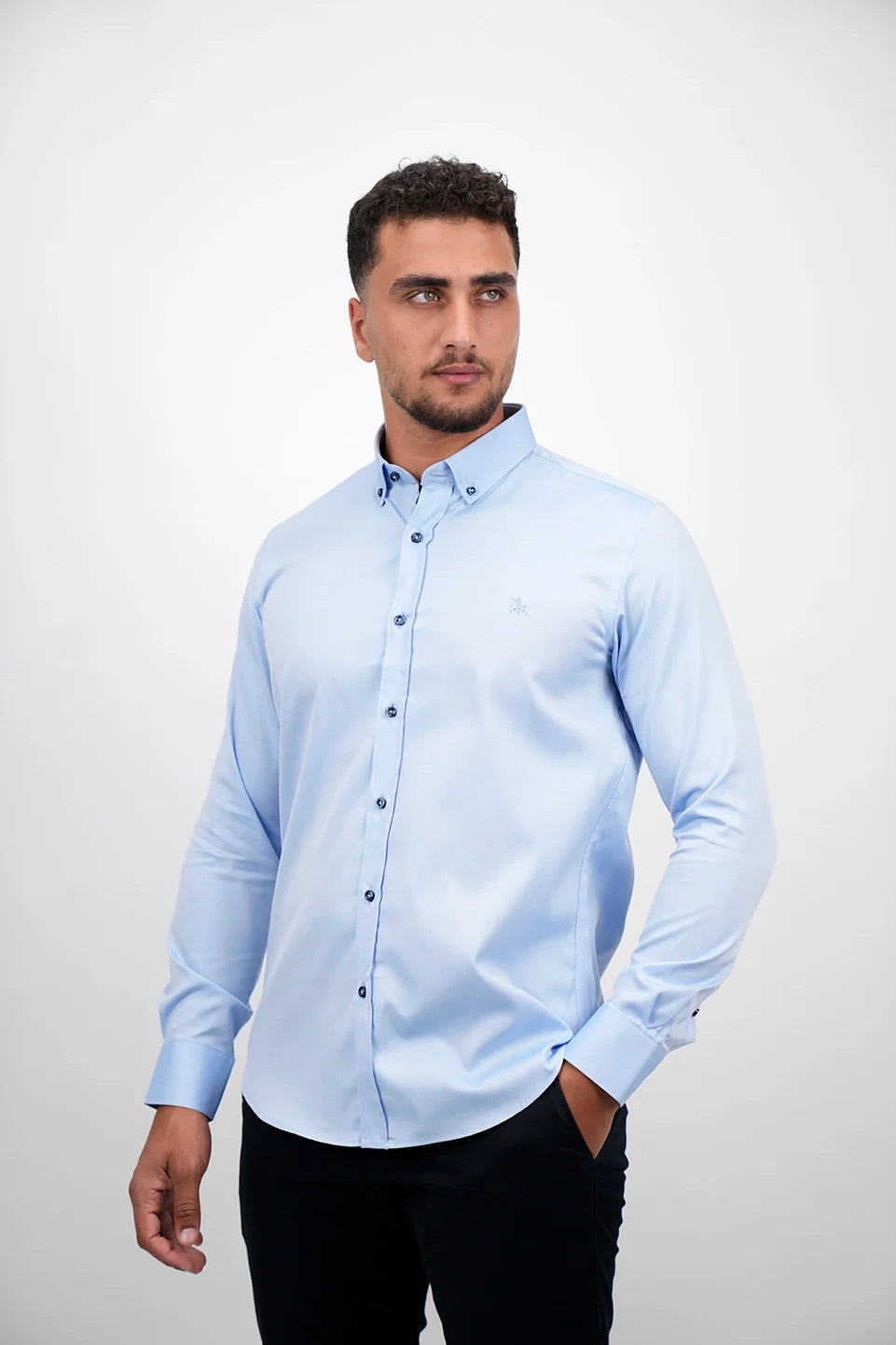 Blue Long Sleeved Shirt With Black Button To Close