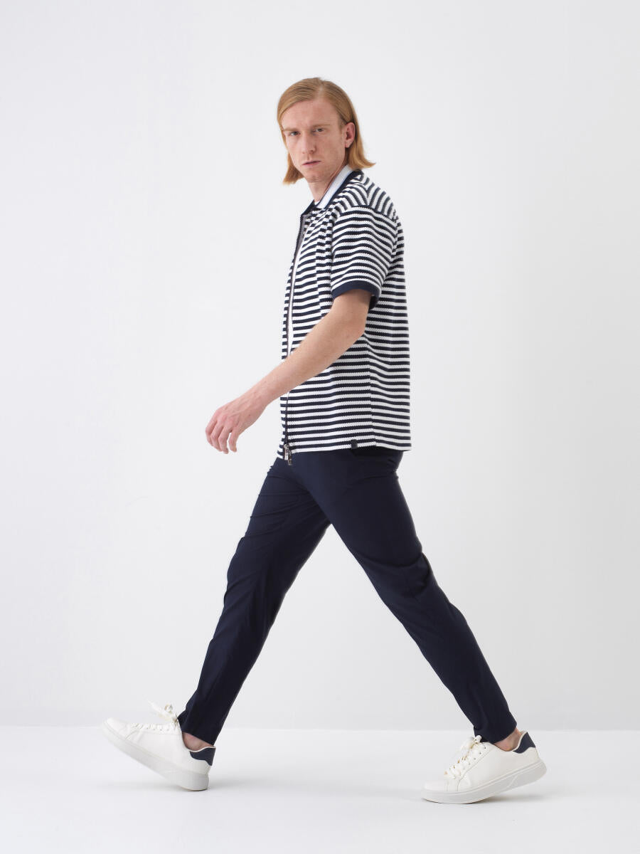 Xint Short Sleeved Navy Polo With A Striped Design