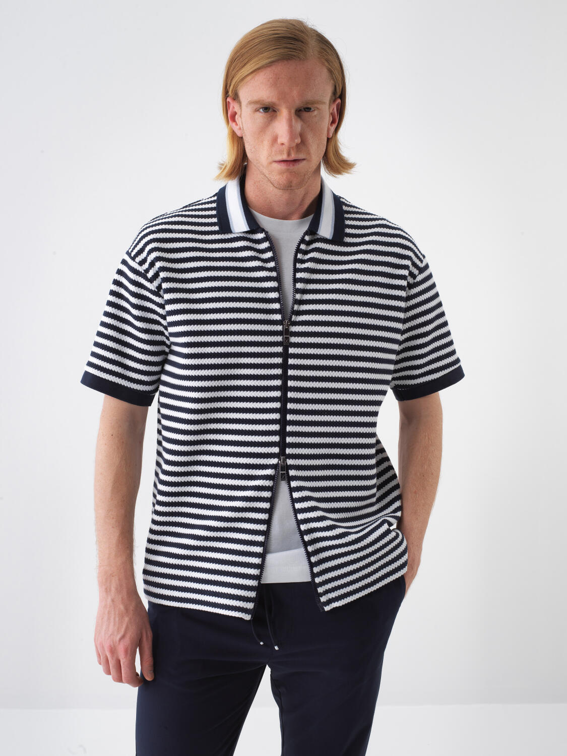 Xint Short Sleeved Navy Polo With A Striped Design